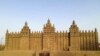 FILE—The world's largest mud-brick building, the Great Mosque of Djenne, Mali, awaits its annual replastering, May 10, 2024.