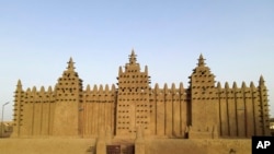 FILE—The world's largest mud-brick building, the Great Mosque of Djenne, Mali, awaits its annual replastering, May 10, 2024.