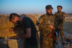 Soldiers loyal to the Kurdish-lead Syrian Democratic forces say they are prepared to fight if or when the US leaves, Aug. 30, 2019 in Al-Bab, Syria. (VOA/Yan Boechat)