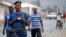 Burundi police patrol the streets of Musaga district in the capital Bujumbura after the results of the presidential elections were released, July 24, 2015.