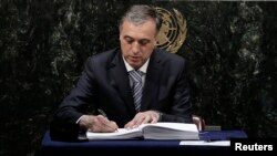 Montenegro President Filip Vujanovic signs the Paris Agreement on climate change at the United Nations Headquarters in New York, April 22, 2016.