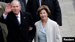 Former President of the United States George W. Bush and wife Laura Bus.