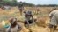 FILE - Illegal artisanal miners look for gold in Mazowe district, about 40 km north of Harare, Zimbabwe, Nov. 26, 2020. (Columbus Mavhunga/VOA)