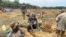 FILE - Illegal artisanal miners look for gold in Mazowe district, about 40 km north of Harare, Zimbabwe, Nov. 26, 2020. (Columbus Mavhunga/VOA)