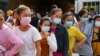 FILE- Garment factory workers and staff wait to receive China's Sinovac coronavirus disease (COVID-19) vaccine at an industrial park in Phnom Penh, Cambodia, on April 7, 2021. REUTERS/Cindy Liu