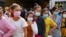FILE- Garment factory workers and staff wait to receive China's Sinovac coronavirus disease (COVID-19) vaccine at an industrial park in Phnom Penh, Cambodia, on April 7, 2021. REUTERS/Cindy Liu
