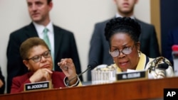 FILE - Rep. Sheila Jackson Lee, right, speaks during a hearing about reparation for the descendants of slaves before the House Judiciary Subcommittee on the Constitution, Civil Rights and Civil Liberties, at the Capitol in Washington, June 19, 2019.