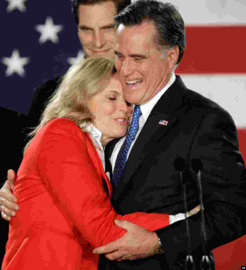 Republican presidential candidate Mitt Romney hugs his wife Ann during a Caucus night rally in Des Moines, Iowa, Tuesday, Jan. 3, 2012. (AP)