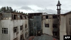 Une vue de l'hôtel après un incendie a fait au moins 19 morts à Harbin, dans la province du Heilongjiang, en Chine, le 25 août 2018.