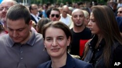 Serbian Prime Minister Ana Brnabic, center, attends a gay pride march in Belgrade, Serbia, Sept. 17, 2017.