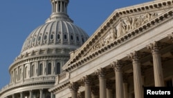 FILE - The U.S. Capitol Hill building, left, is pictured in Washington, D.C., Oct. 4, 2013. 