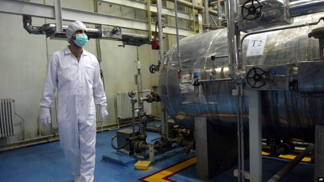 FILE - In this Feb. 2007 photo, an Iranian technician walks through the Uranium Conversion Facility just outside the city of Isfahan 410 kilometers (255 miles) south of the capital, Tehran.
