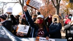 FILE - Demonstrators chant during an immigration rally asking Congress to support Deferred Action for Childhood Arrivals, citizenship for workers and passage of President Joe Biden's legislative agenda on Capitol Hill in Washington, Dec. 7, 2021.