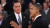 U.S. President Barack Obama (R) speaks as Republican presidential nominee Mitt Romney (L) listens during the second U.S. presidential debate in Hempstead, New York, October 16, 2012. 