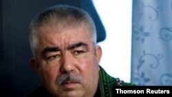 FILE - Afghan General Abdul Rashid Dostum speaks during an interview with Reuters at his palace in Shibergan, in northern Afghanistan Aug. 19, 2009.