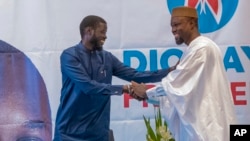 FILE—Senegal's top opposition leader Ousmane Sonko, right, and his key ally Bassirou Diomaye Faye address supporters in Dakar, Senegal, March 15, 2024. 