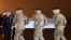 Army Chief of Staff Gen. Mark A. Milley, left, salutes as an Army carry team moves a transfer case containing the remains of Maj. Brent R. Taylor at Dover Air Force Base, Del., on Tuesday, Nov. 6, 2018.