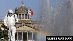 MEXICO – A worker sprays disinfectant during a campaign to sanitize public spaces as a preventive measure against the spread of COVID-19, in Guadalajara, Mexico, on March 20, 2020.