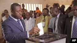 FILE - Togo President Faure Gnassingbe casts his ballot in Lome during legislative elections July 25, 2013.