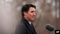 Canada Prime Minister Justin Trudeau announces his resignation as Liberal leader and prime minister outside Rideau Cottage in Ottawa on Jan. 6, 2025. (Sean Kilpatrick/The Canadian Press via AP)