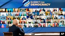 President Joe Biden speaks from the South Court Auditorium on the White House complex in Washington, Thursday, Dec. 9, 2021, for the opening of the Democracy Summit. (AP Photo/Susan Walsh)