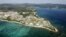 FILE - Coral reefs are seen along the coast near the U.S. Marine base Camp Schwab, off the tiny hamlet of Henoko in Nago on the southern Japanese island of Okinawa, in this aerial photo taken by Kyodo, Oct. 29, 2015.