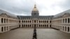 People queue to pay tribute to late French President Jacques Chirac during a popular national tribute at the Hotel des Invalides in Paris.