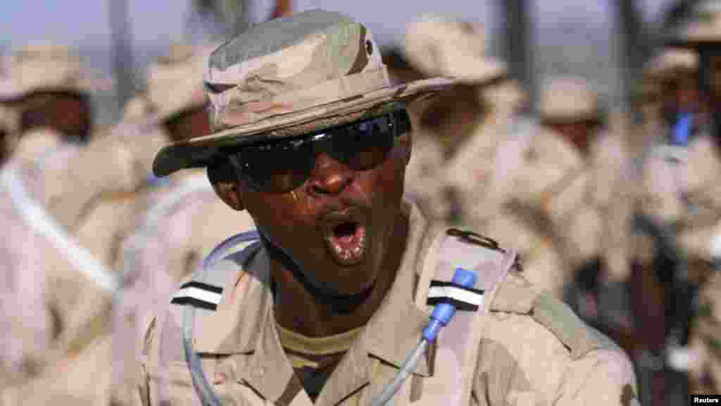 A Nigerian Army soldier gestures during preparations for deployment to Mali.