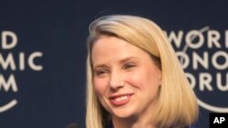 FILE - Yahoo CEO Marissa Mayer smiles during a session at the World Economic Forum in Davos, Switzerland.