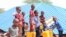 Children are filling their water containers at the makeshift Camp for Yemeni refugees near the Somali capital Mogadishu. (Courtesy of Muslim Aid)