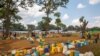 Empty jerrycans are arranged by refugees from Burundi who fled the ongoing violence and political tension at a water tap at the Nyarugusu refugee camp in western Tanzania, May 28, 2015. 