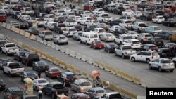  Cars wait to cross at San Ysidro border crossing between the U.S. and Mexico, in Tijuana, Mexico, May 6, 2019. An American man was arrested in a car chase to the crossing that left several people injured.