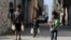 Palestinian boys carry bottles of water in Al-Shati refugee camp in Gaza City, Oct. 23, 2019. 