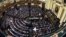 FILE - Members of Egypt's Parliament attend the inaugural session, the first to convene in three years, in Cairo.