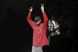 FILE - Kanye West acknowledges attendees before his Yeezy Season 3 Collection presentation during New York Fashion Week, Feb. 11, 2016.