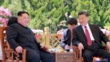 North Korean leader Kim Jong Un meets with China's President Xi Jinping, in Dalian, China in this undated photo released on May 9, 2018 by North Korea's Korean Central News Agency (KCNA).