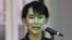 Burmese ro-democracy leader Aung San Suu Kyi talks to reporters in Rangoon, April 26, 2012. 