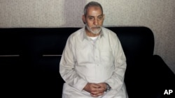 FILE - Muslim Brotherhood leader Mohamed Badie is seen in a photo released Aug. 20 by Egypt's Interior Ministry following his detention.