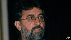 FILE - Tarun Tejpal, editor in chief Tehelka.com, talks to the media, Mar. 13, 2001.