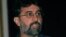 FILE - Tarun Tejpal, editor in chief Tehelka.com, talks to the media, Mar. 13, 2001.