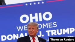 Former US President Donald Trump looks on during his first post-presidency campaign rally at the Lorain County Fairgrounds in Wellington, Ohio, June 26, 2021.