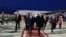Tunisia's Prime Minister Youssef Chahed, front right, walks with his French counterpart Manuel Valls, left, upon his arrival at Tunis airport in Tunis, Tunisia, Nov. 28, 2016. 