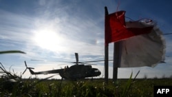 A Mi-8 military helicopter takes off during a training flight at an undisclosed location in Lviv region on November 7, 2024, amid the Russian invasion of Ukraine.