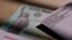 FILE - A stimulus check issued by the IRS to help combat the adverse economic effects of the COVID-19 outbreak is seen in San Antonio, Jan. 28, 2021.
