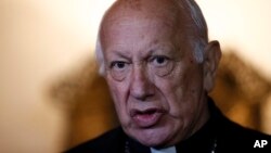 The archbishop of Santiago, Ricardo Ezzati, speaks to the press after his first Mass, after returning from the Vatican, in Santiago, May 18, 2018. 