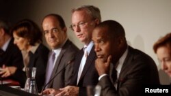 Google Executive Chairman Eric Schmidt, center, joins panelists hearing privacy and public information concerns in Madrid Sept. 9, 2014.