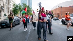 Alia Amanpour Trapp, center, leads the crowd during a pro-Palestine rally and march on Temple University campus in Philadelphia, Pennsylvania, Aug. 29, 2024. 