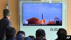 FILE - People watch a TV screen showing file footage of North Korea's missile launch at Seoul Railway Station in Seoul, South Korea, Nov. 21, 2017.