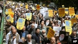 Worshippers chant slogans against the United States and Israel during a rally after Friday prayers in Tehran, Iran, May 10, 2019. 