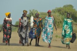 Women walk to the market in Udier town, in South Sudan on March 7, 2019.